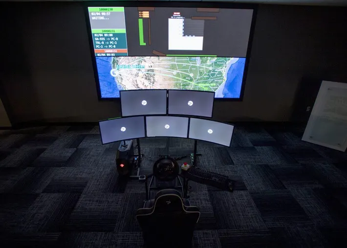 Phantom Auto operations center with wall display and operator cockpit stations