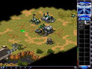 Command & Conquer: Red Alert 2 gameplay showing an early Allied base with tanks and construction yards